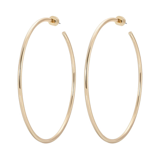 Gold hoop earrings from the 3 Inch Ultimate Hoops collection looking shiny and stylish